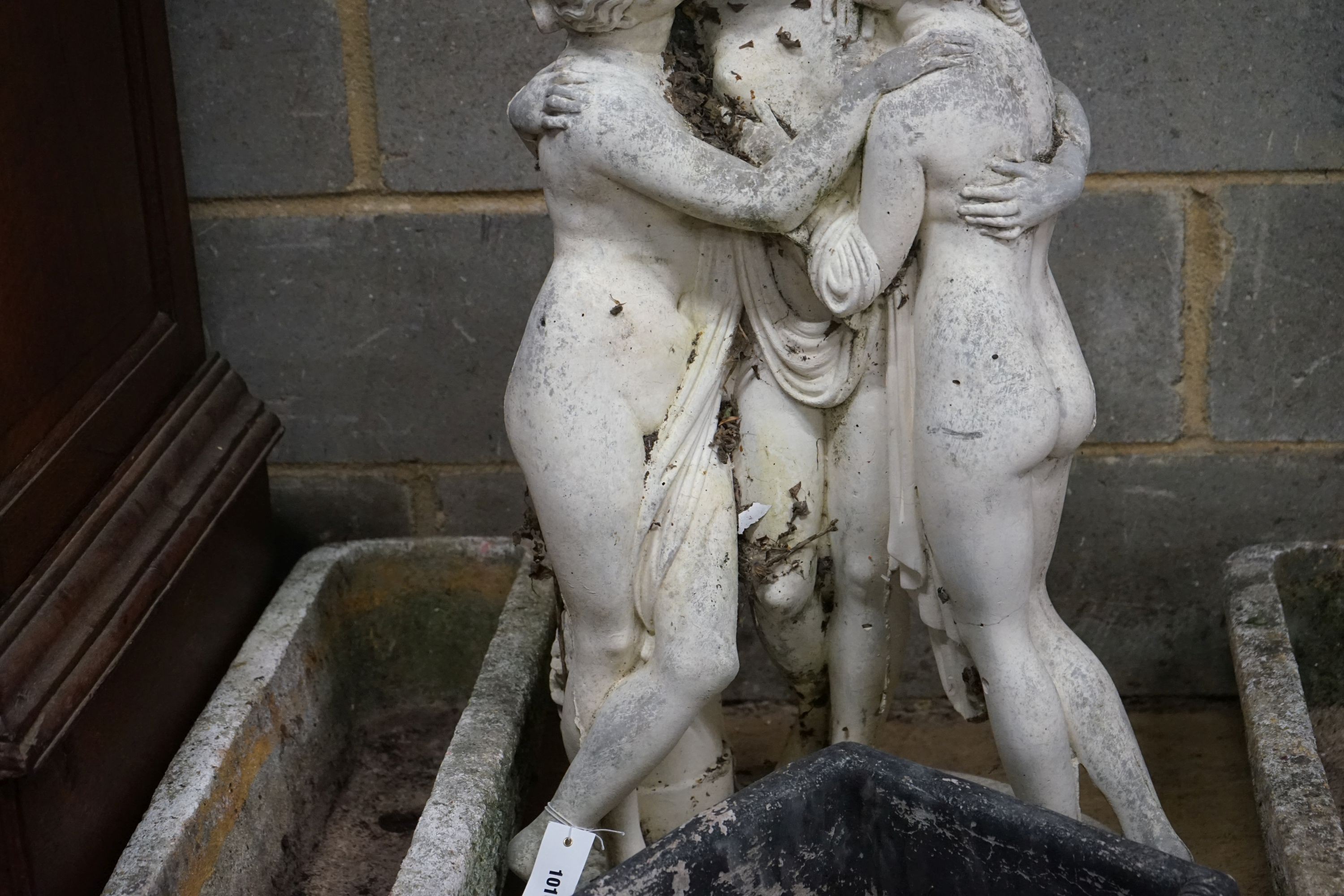 A reconstituted stone garden ornament, the Three Graces, height 84cm together with three planters